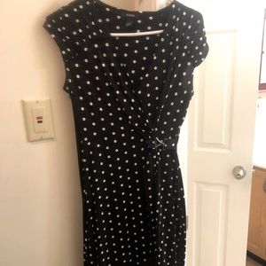Silky, slinky wrap dress. Very comfortable and flattering. Quality make